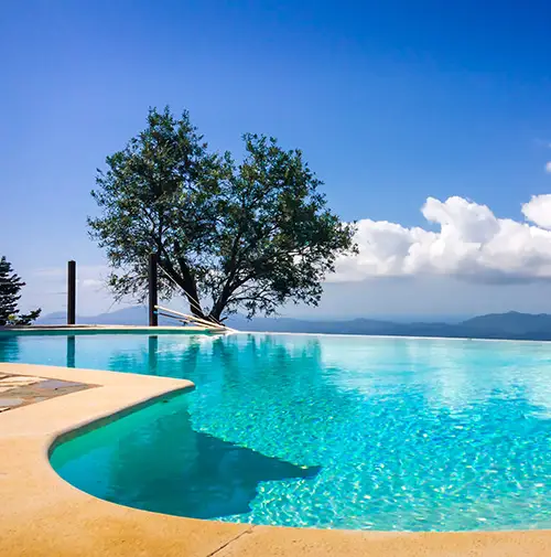 An infinity swimming pool which is one of the features show on the custom holiday website